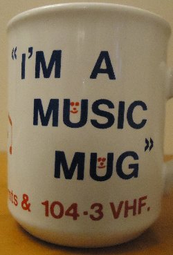 An original Signal Radio mug showing the 104.3 VHF frequency