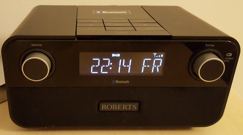 A brand new Roberts alarm clock radio showing the time as 22:14 on a Friday